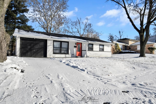 ranch-style home featuring a garage