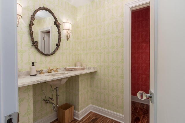 bathroom featuring sink and wood-type flooring