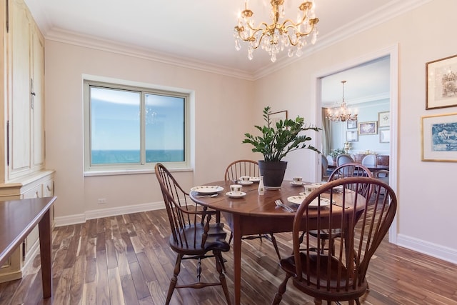 dining room with crown molding, a notable chandelier, and dark wood-type flooring