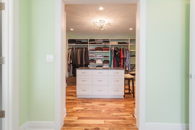 spacious closet with light hardwood / wood-style floors