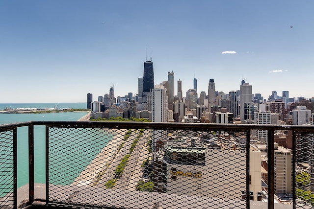 balcony featuring a water view