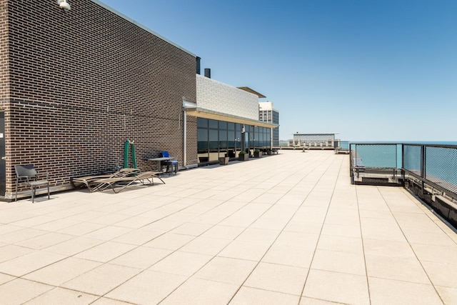 view of patio with a water view