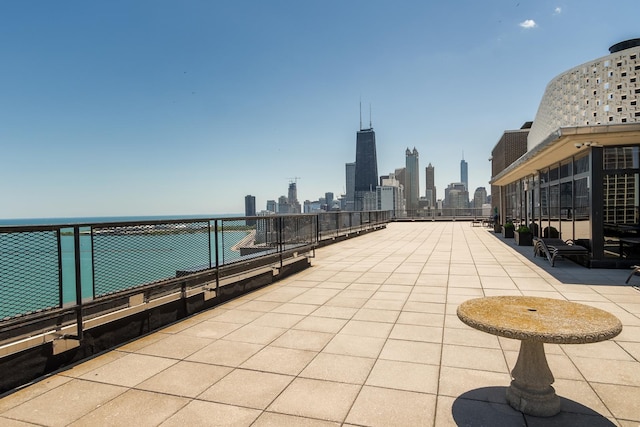 view of patio / terrace with a water view