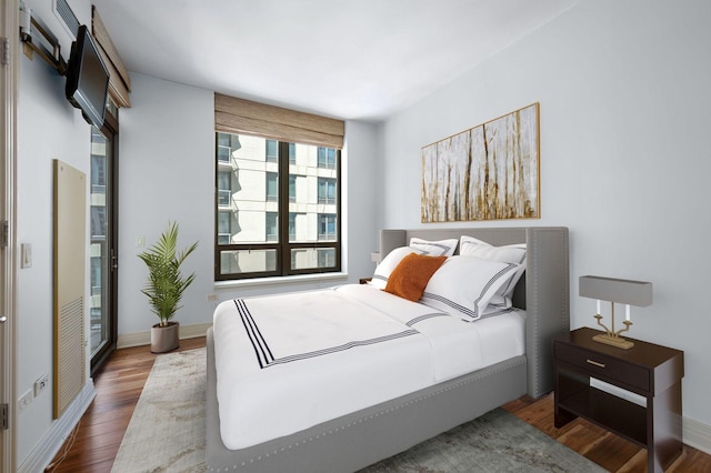 bedroom featuring dark hardwood / wood-style floors