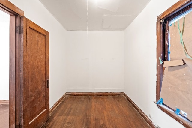 hallway with dark wood-type flooring