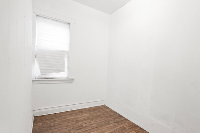 spare room featuring dark wood-type flooring