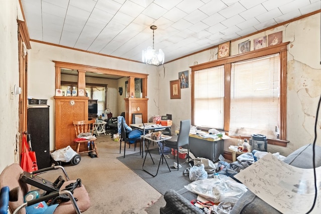 miscellaneous room featuring ornamental molding, a notable chandelier, and carpet flooring