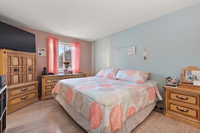 bedroom featuring light hardwood / wood-style floors