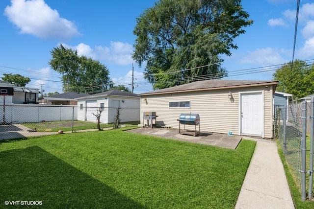 back of house featuring a patio area and a lawn