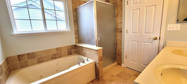 bathroom with independent shower and bath, tile patterned flooring, and vanity