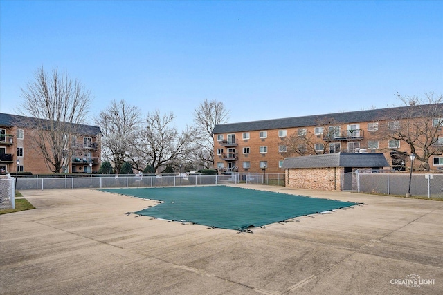 view of pool featuring central air condition unit and a patio