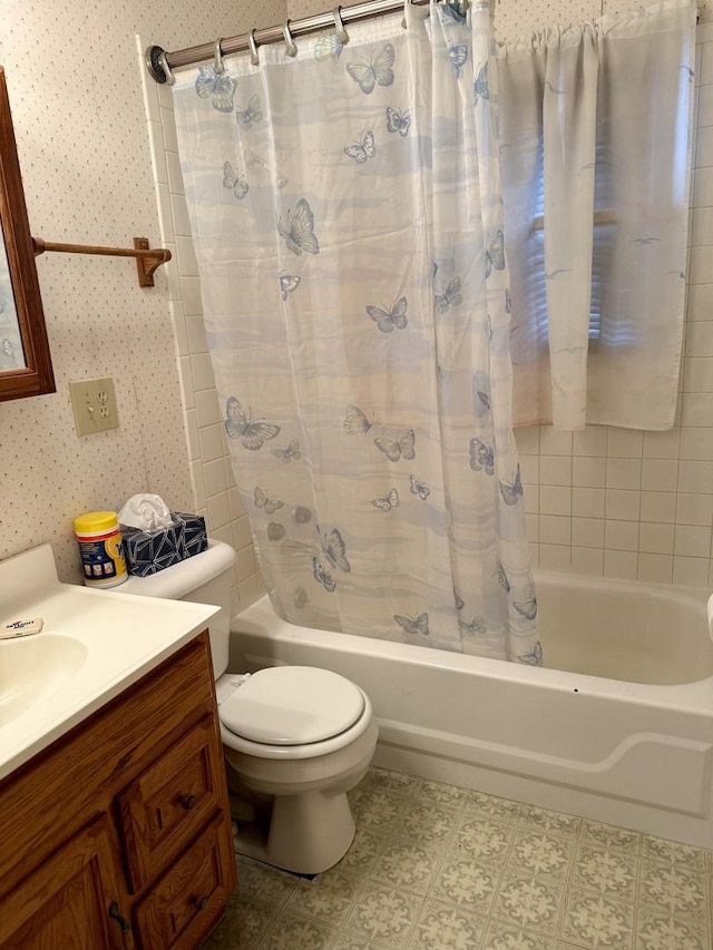 full bathroom featuring toilet, vanity, and shower / tub combo