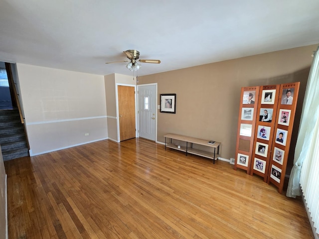 spare room featuring ceiling fan and light hardwood / wood-style flooring