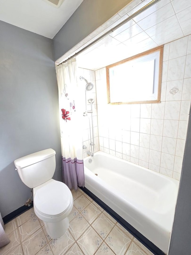 bathroom featuring toilet, tile patterned floors, and shower / bathtub combination with curtain