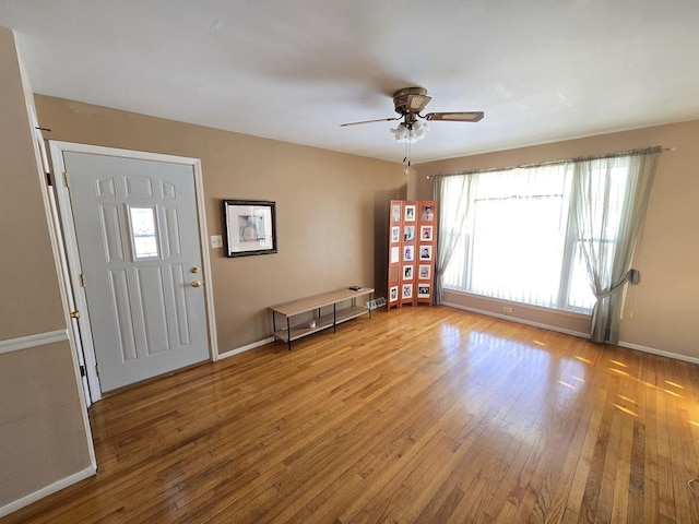 entrance foyer featuring ceiling fan and light hardwood / wood-style floors