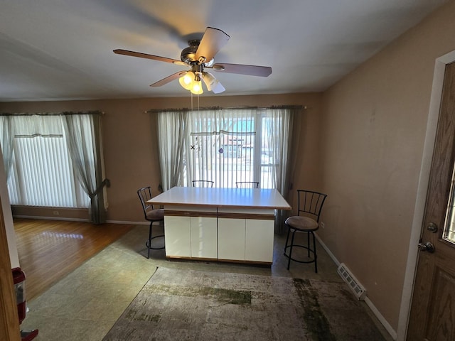 dining area with ceiling fan