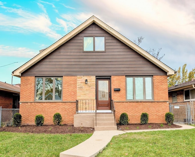 bungalow-style house featuring a front yard