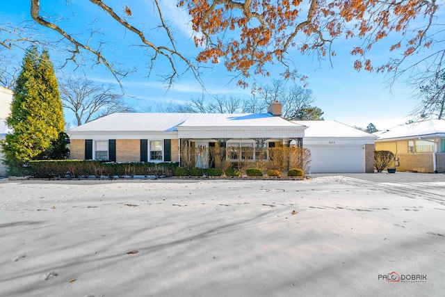 ranch-style house featuring a garage