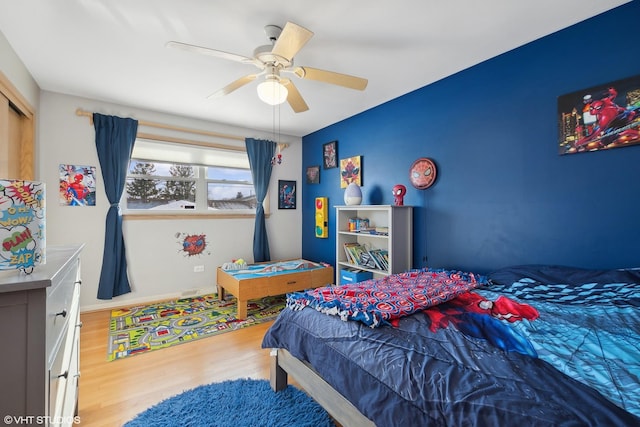 bedroom featuring ceiling fan and light hardwood / wood-style flooring