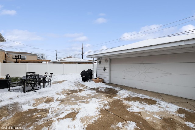 view of snow covered garage