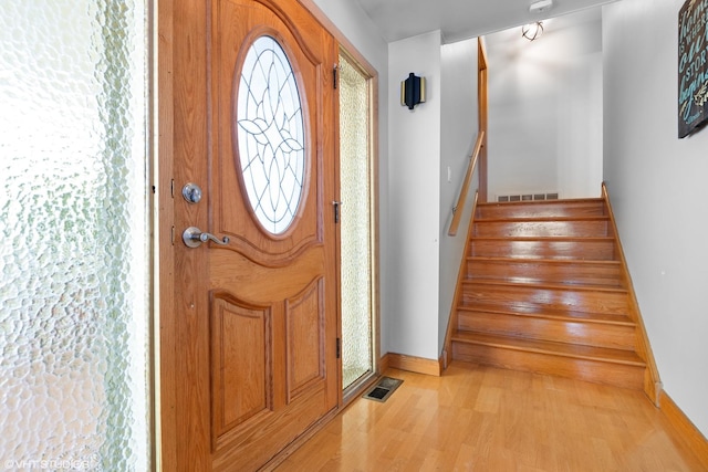 foyer entrance with light wood-type flooring