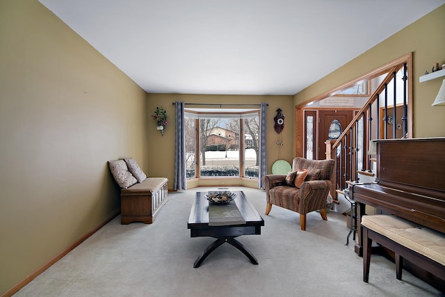 sitting room featuring light colored carpet