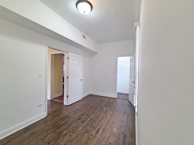 spare room featuring dark hardwood / wood-style flooring