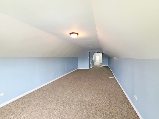 bonus room featuring carpet and lofted ceiling