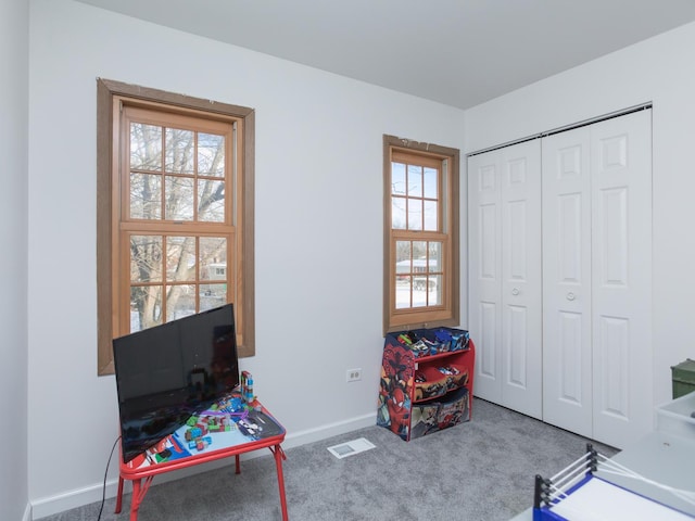 rec room featuring a wealth of natural light and carpet