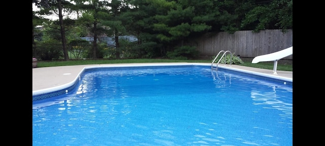 view of pool featuring a water slide