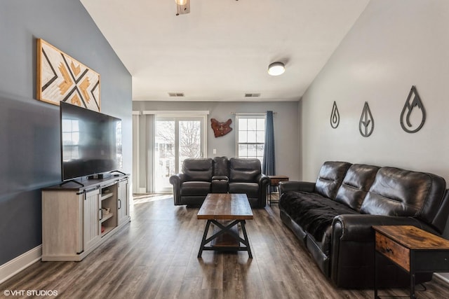 living room featuring dark hardwood / wood-style flooring