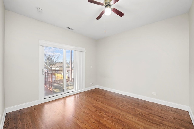 spare room with wood-type flooring and ceiling fan