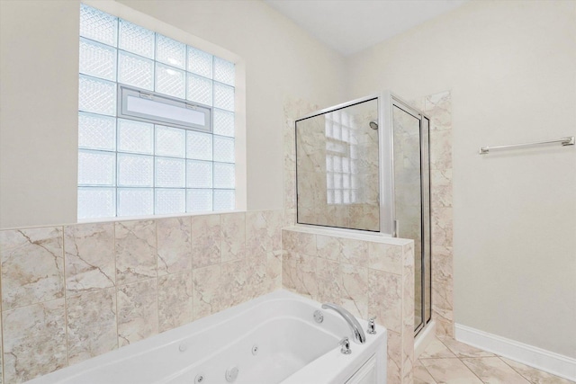 bathroom featuring separate shower and tub