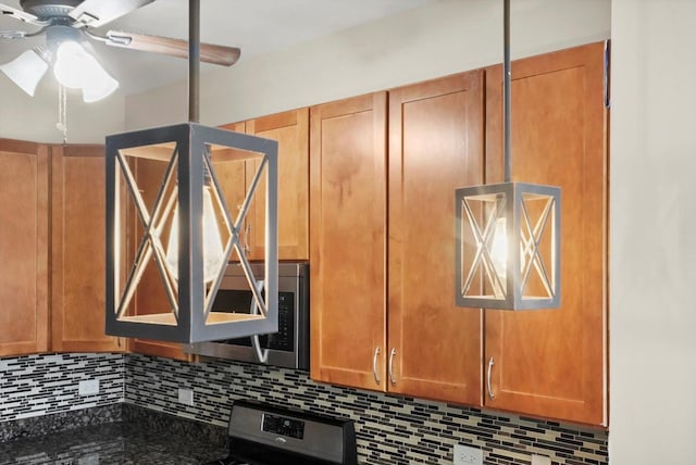 details with decorative backsplash, ceiling fan, and appliances with stainless steel finishes