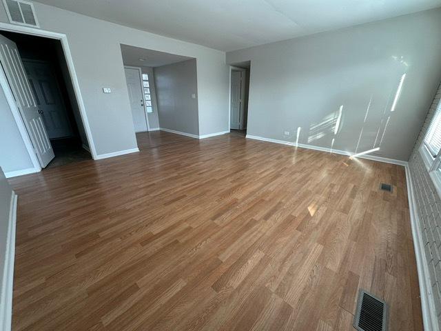 empty room featuring hardwood / wood-style floors