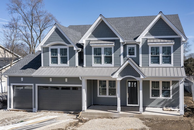 view of front of house featuring a garage, a standing seam roof, a shingled roof, and a porch