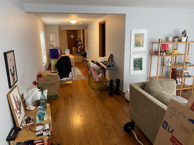 hallway with hardwood / wood-style floors