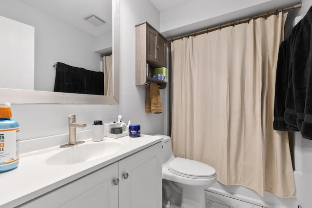 full bathroom featuring toilet, vanity, and shower / tub combo