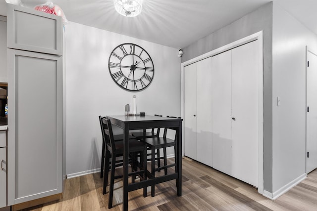 dining area with hardwood / wood-style flooring