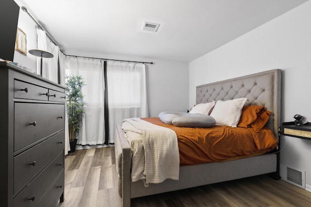 bedroom featuring hardwood / wood-style flooring