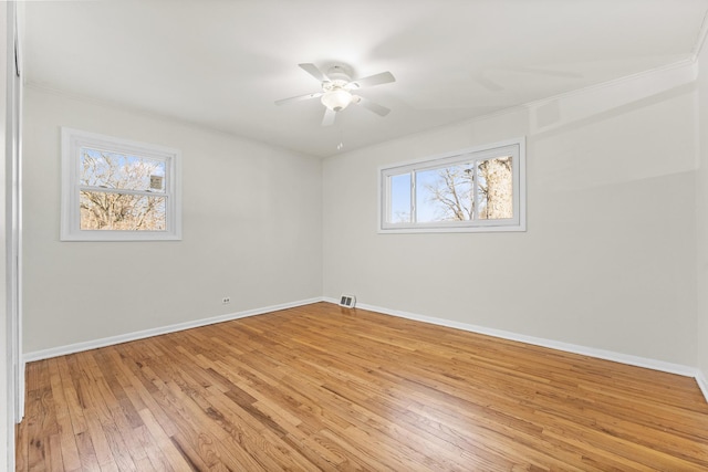 unfurnished room featuring crown molding, ceiling fan, and light hardwood / wood-style flooring