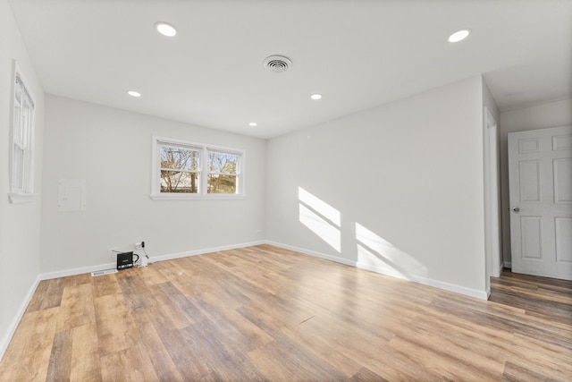 spare room featuring light wood-type flooring