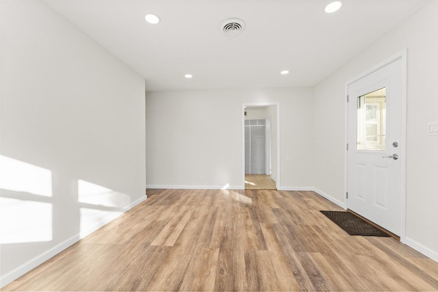 foyer entrance with light hardwood / wood-style floors