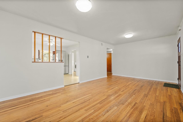 spare room featuring light wood-type flooring