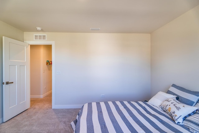 bedroom featuring light carpet