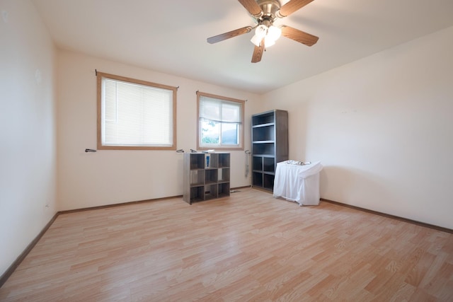 unfurnished room with ceiling fan and light hardwood / wood-style floors