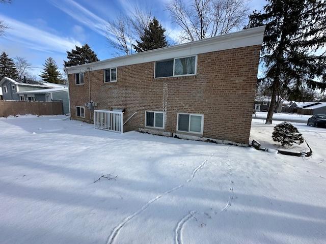 view of snow covered house