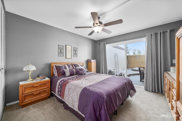 bedroom featuring ceiling fan, light colored carpet, and access to exterior