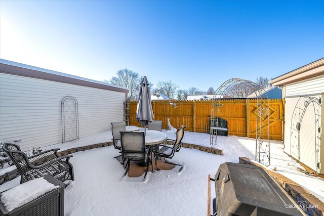 view of snow covered patio