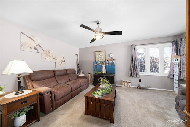 living room featuring ceiling fan and light carpet